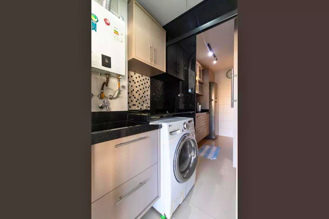 a laundry room with a washing machine