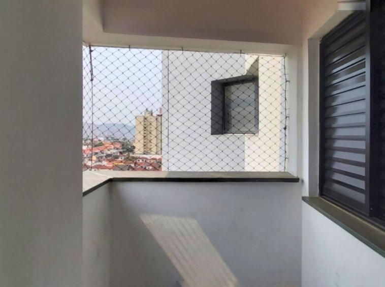 a balcony with a fence and a window