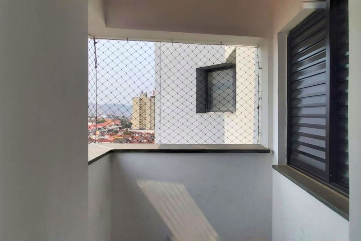 a balcony with a fence and a window