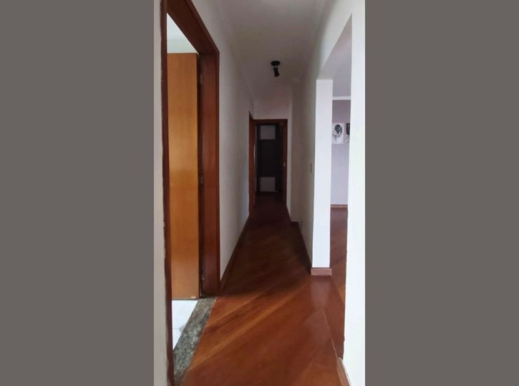 a hallway with a wood floor